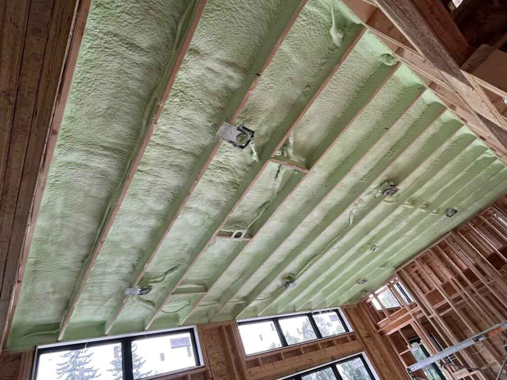 Spray foam insulation installed in ceiling of new house build