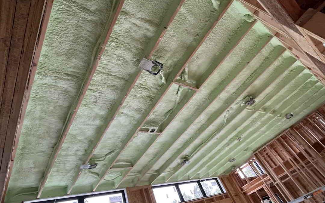 Spray foam insulation installed in ceiling of new house build